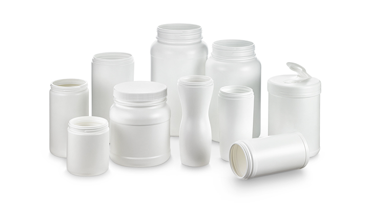a group of plastic canisters from Comar