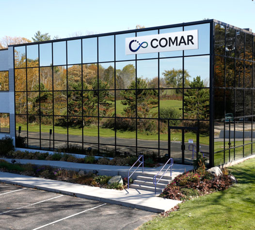 Exterior shot of comar facility with glass walls